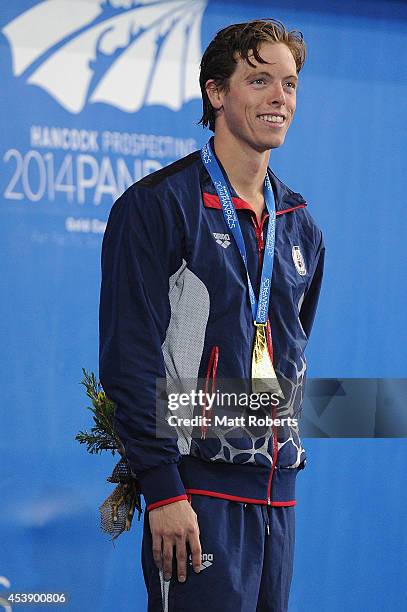 Connor Jaeger of the United States smiles on the podium after winning the Men's 1500m Final during day one of the 2014 Pan Pacific Championships at...