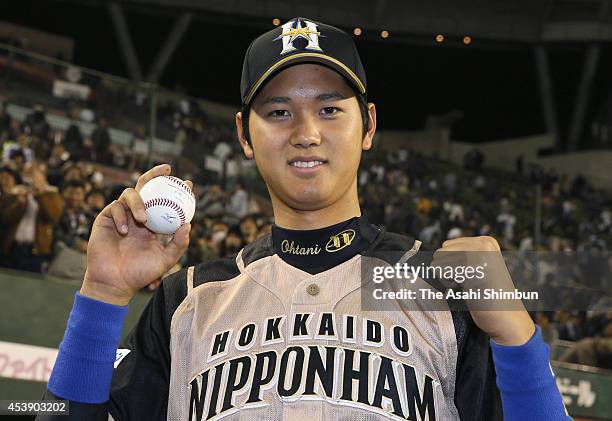 Shohei Otani of Hokkaido Nippon-Ham Fighters poses for a photograph after being interviewed for hitting his first career hit at the Seibu Stadium on...