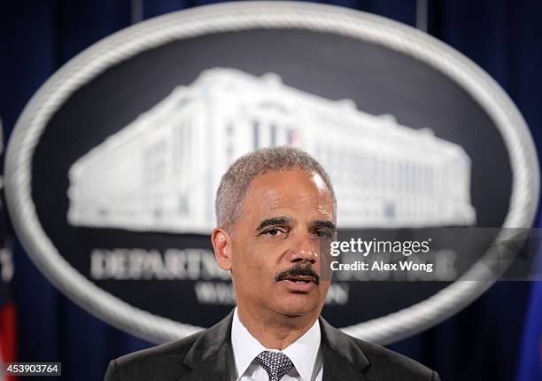 Attorney General Eric Holder makes a major financial fraud announcement during a press conference August 21, 2014 at the Justice Department in...