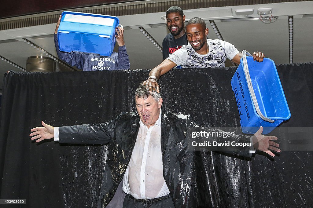 MLSE stars Nazem Kadri,  Amir Johnson, and Jermain Defoe, dump ice water on Tim Leiweke, as part of the Ice Bucket Challenge