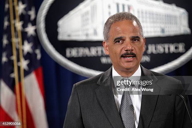 Attorney General Eric Holder makes a major financial fraud announcement during a press conference August 21, 2014 at the Justice Department in...