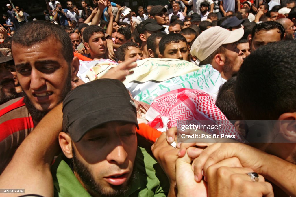 Palestinians during the funeral of three top senior Hamas...