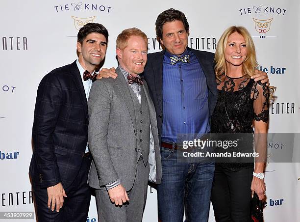 Justin Mikita, Jesse Tyler Ferguson, Steven Levitan and Krista Levitan arrive at the "Tie The Knot" grand store opening at The Beverly Center on...