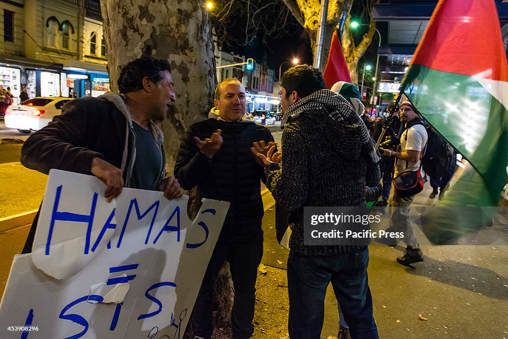Pro Palestine demonstrator argues pacifically with a Pro...
