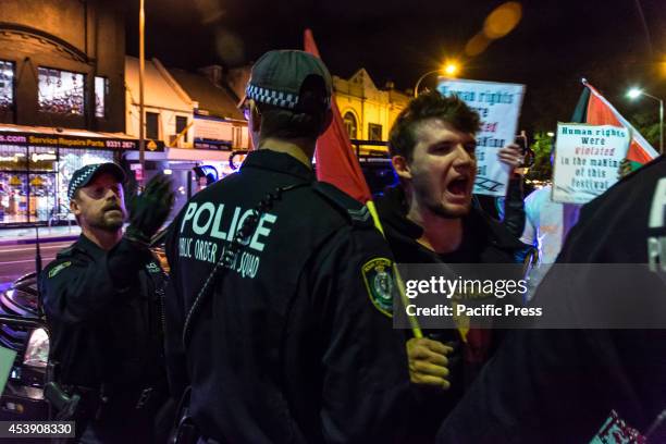 Police moving demonstrators back in the sidewalk at to Pro-Palestine protest against the Israeli Film Festival in Sydney, as part of the boycott...