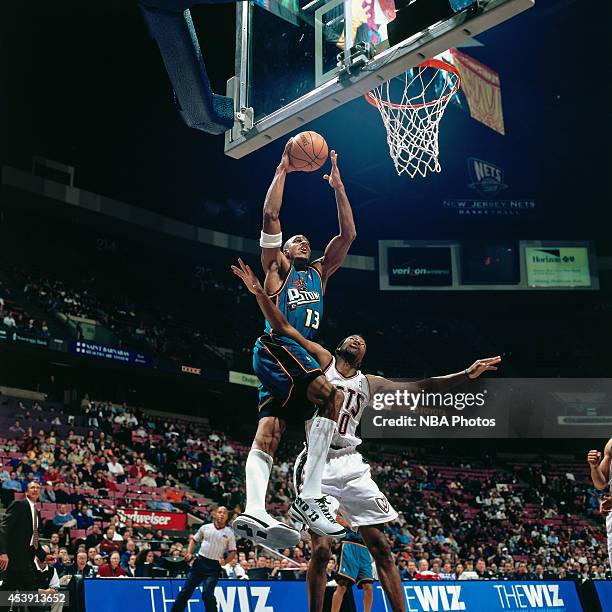 Jerome Williams of the Detroit Pistons shoots against the New Jersey Nets during a game played circa 2001 at Continental Airlines Arena in East...