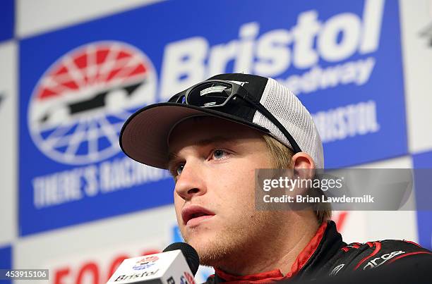 Chris Buescher, driver of the Roush Performance Parts Ford, speaks at a press conference at Bristol Motor Speedway on August 21, 2014 in Bristol,...