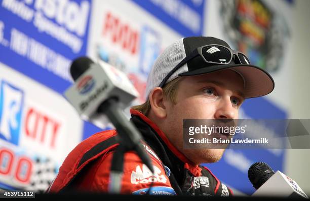 Chris Buescher, driver of the Roush Performance Parts Ford, speaks at a press conference at Bristol Motor Speedway on August 21, 2014 in Bristol,...