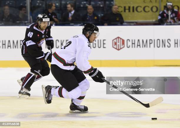 Daniel Rubin of Geneve-Servette and Elias Falth of Frolunda Gothenburg fight for the puck during the Champions Hockey League group stage game between...