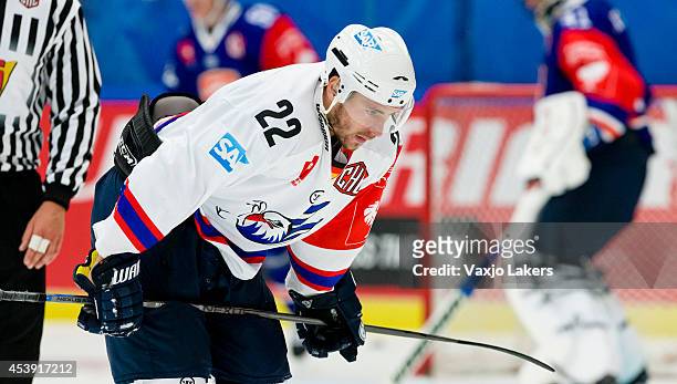 Matthias Plachta of Adler Mannheim is feeling pain after a hit by Teemu Laakso of Växjö Lakers during the Champions Hockey League group stage game...