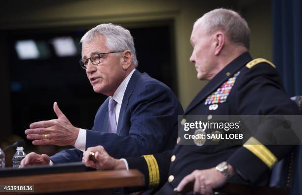 Secretary of Defense Chuck Hagel and Chairman of the Joint Chiefs of Staff General Martin Dempsey hold a press briefing at the Pentagon in...