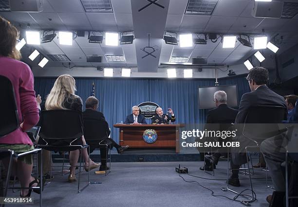 Secretary of Defense Chuck Hagel and Chairman of the Joint Chiefs of Staff General Martin Dempsey hold a press briefing at the Pentagon in...