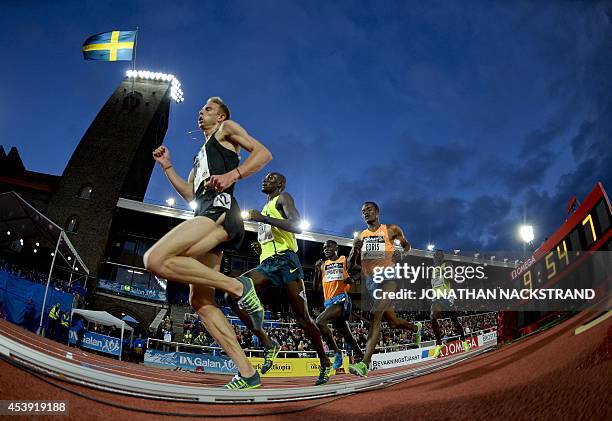 Ethiopia's Muktar Edris and Ethiopia's Thomas Pkemei Longosiwa compete during the Men 5000m event during the IAAF Diamond League DN Galan meeting at...