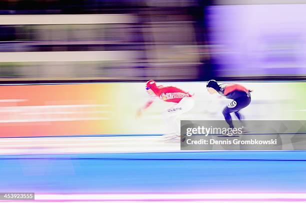 Sergey Gryaztsov of Russia is chased by Mathuez Giroux of Canada during the Men's 1500m Division B competition on Day 1 of the Essent ISU World Cup...