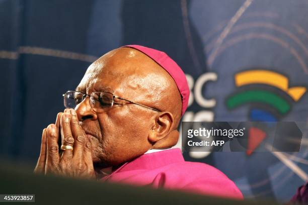South Africa's Archbishop Desmond Tutu pauses for a moment during a media briefing on December 6, 2013 in Cape Town, a day after the death of his...