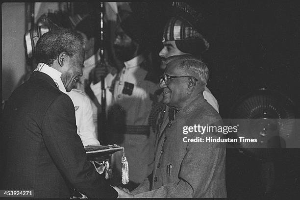 South African President Nelson Mandela receiving the Bharat Ratna Award from Indian President on October 16, 1990 in New Delhi, India. Revered icon...