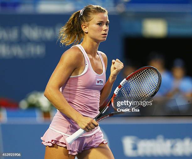 Camila Giorgi of Italy celebrates her match win over Garbine Muguruza of Spain during the Connecticut Open at the Connecticut Tennis Center at Yale...