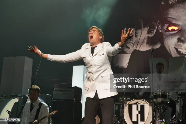 Dr. Matt Destruction, Howlin' Pelle Almqvist and Chris Dangerous of The Hives perform on stage at Brixton Academy on August 21, 2014 in London,...