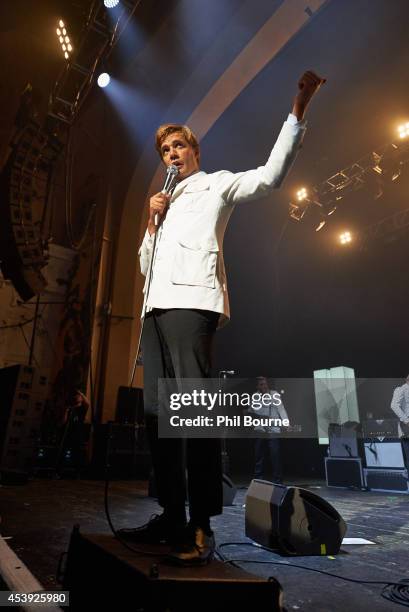 Howlin' Pelle Almqvist of The Hives performs on stage at Brixton Academy on August 21, 2014 in London, United Kingdom.
