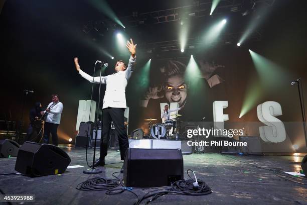 Vigilante Carlstroem, Howlin' Pelle Almqvist and Chris Dangerous of The Hives perform on stage at Brixton Academy on August 21, 2014 in London,...