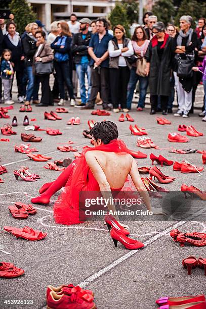 Women's shoes red, exposed through the streets, squares and monuments of the city, to saying stop to gender violence. Red as the blood that every day...