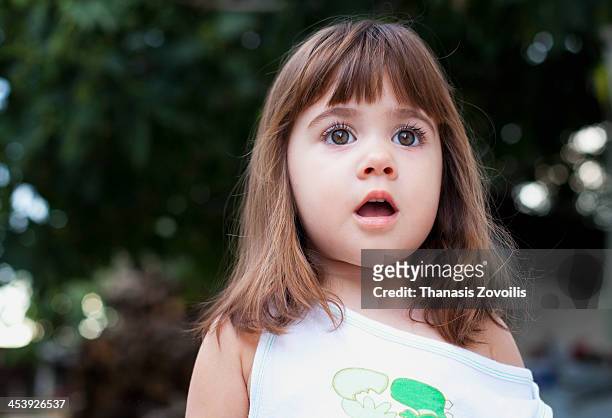 portrait of a small girl - disbelief stock pictures, royalty-free photos & images