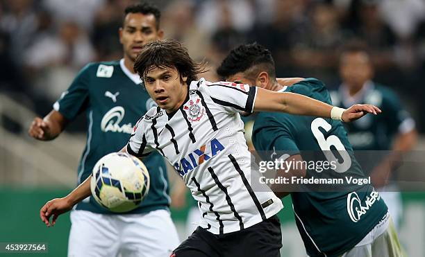 Angel Romero of Corinthians fights for the ball with Lima of Goias during the match between Corinthians and Goias for the Brazilian Series A 2014 at...