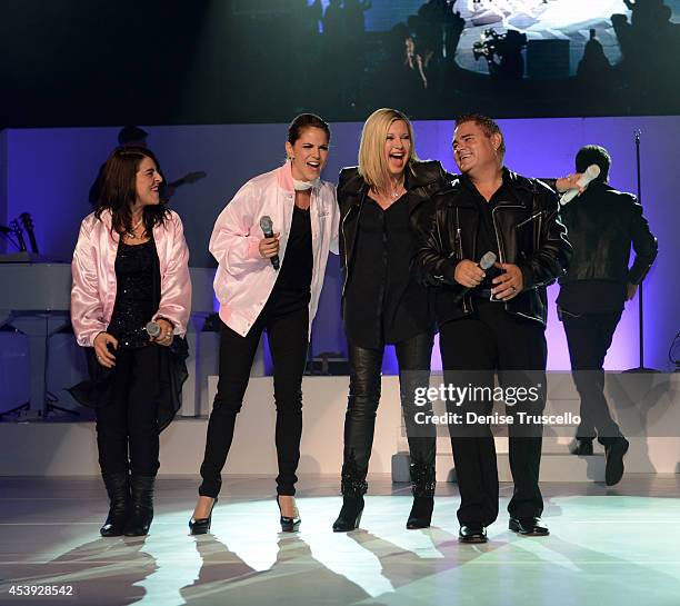 Marlen Landin, Natalie Morales, Olivia Newton-John and Steve Real perform during Olivia Newton-John's residency "Summer Nights" at the Flamingo Las...