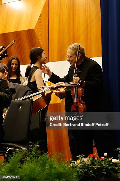 Dami Kim receive a Price by Jean Bonvin and Shlomo Mintz during the concert of close of the Summer season on August 16, 2014 in Crans-Montana,...