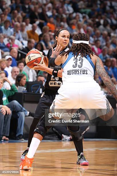 Becky Hammon of the San Antonio Stars looks to pass against Seimone Augustus of the Minnesota Lynx in Game One of the Western Conference Semifinals...