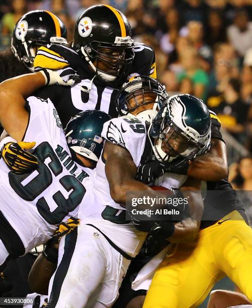 Running back Matthew Tucker of the Philadelphia Eagles scores a touchdown against the Pittsburgh Steelers on August 21, 2014 at Lincoln Financial...