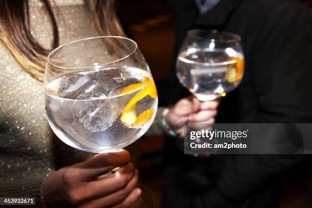 girl with 2 gin tonics - gin tonic stock-fotos und bilder