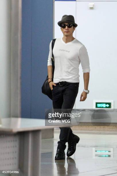 Actor Song Seung-heon arrives at Beijing Capital International Airport on August 21, 2014 in Beijing, China.