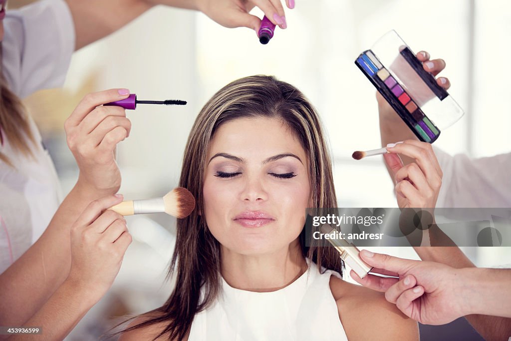Woman getting her makeup done