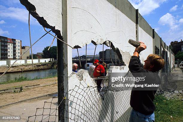 Germany, West Berlin, People Demolishing Berlin Wall To Get A Piece As A Souvenir.