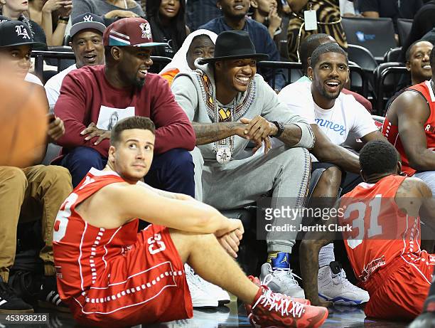Vinny Guadagnino, Tim Hardaway Jr., Carmelo Anthony and Kyrie Irving attend the 2014 Summer Classic Charity Basketball Game at Barclays Center on...