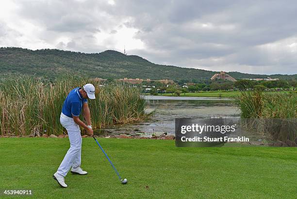 Henrik Stenson of Sweden plays a shot during the second round of the Nedbank Golf Challenge at Gary Player CC on December 6, 2013 in Sun City, South...