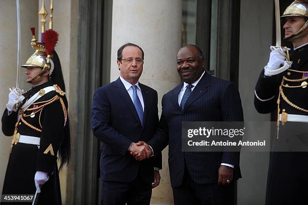 France's President Francois Hollande welcomes his Gabonese counterpart Ali Bongo Ondimba for the Peace And Safety In Africa Summit at Elysee Palace...