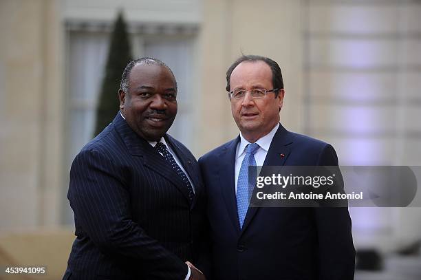 France's President Francois Hollande welcomes his Gabonese counterpart Ali Bongo Ondimba for the Peace And Safety In Africa Summit at Elysee Palace...