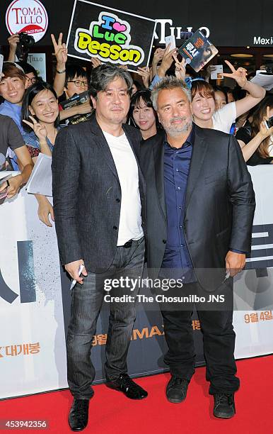 Choi Min-Sik and Luc Besson pose for photographs during the movie "LUCY" red carpet event at IFC mall on August 20, 2014 in Seoul, South Korea.