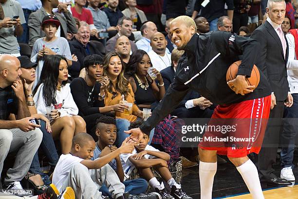 Rapper Chris Brown and singer Rihanna attend the 2014 Summer Classic Charity Basketball Game at Barclays Center on August 21, 2014 in New York City.