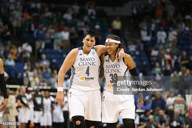 Janel McCarville and Seimone Augustus of the Minnesota Lynx celebrate against the San Antonio Stars in Game One of the Western Conference Semifinals...