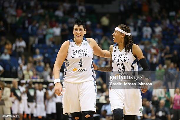 Janel McCarville and Seimone Augustus of the Minnesota Lynx celebrate against the San Antonio Stars in Game One of the Western Conference Semifinals...