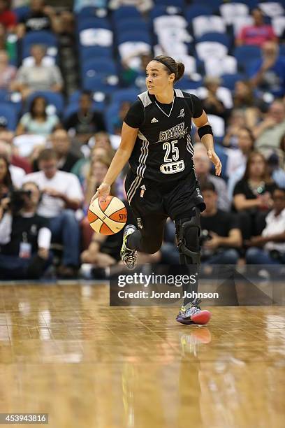 Becky Hammon of the San Antonio Stars handles the ball against the Minnesota Lynx in Game One of the Western Conference Semifinals during the 2014...