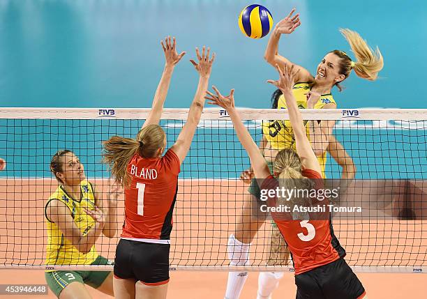 Thaisa Menezes of Brazil spikes the ball against Belgium during the FIVB World Grand Prix Final group one match between Brazil and Belgium on August...