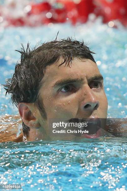 Michael Phelps of the USA looks on after swimming the Men's 100m Freestyle Final during day two of the 2014 Pan Pacific Championships at Gold Coast...