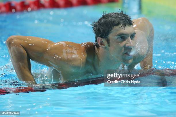 Michael Phelps of the USA looks on after swimming the Men's 100m Freestyle Final during day two of the 2014 Pan Pacific Championships at Gold Coast...