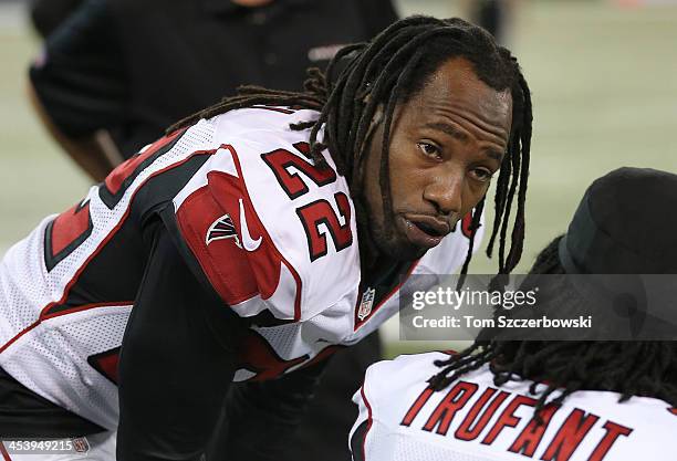 Asante Samuel of the Atlanta Falcons talks to Desmond Trufant on the bench during an NFL game against the Buffalo Bills at Rogers Centre on December...