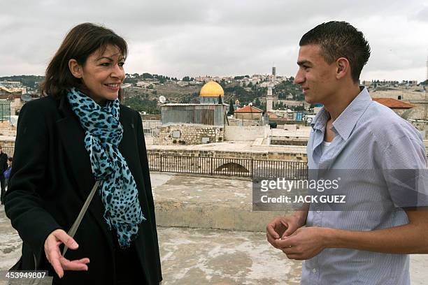 Anne Hidalgo, Paris deputy mayor and Socialist Party candidate for the primary round of Paris municipal elections, talks with a young Arab Israeli...
