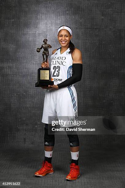 Maya Moore of the Minnesota Lynx poses with the 2014 WNBA Most Valuable Player Award to before a press conference on August 21, 2014 at Target Center...